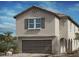 Charming two-story home with a traditional design, attached garage, and beautiful architectural details at 10032 Indy Rey Ct, Las Vegas, NV 89148