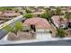 Beautiful aerial view of a well-maintained single-story home with a red tile roof and desert landscaping at 10201 Los Padres Pl, Las Vegas, NV 89134