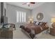 Comfortable bedroom featuring a plush bed, side tables, and natural light at 10201 Los Padres Pl, Las Vegas, NV 89134