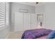Bedroom featuring shuttered windows, closet, and doorway leading to the bathroom at 10201 Los Padres Pl, Las Vegas, NV 89134