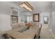 Open dining area with decorative wooden chandelier and modern furnishings at 10201 Los Padres Pl, Las Vegas, NV 89134