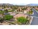 Cozy single-story home with well-kept landscaping, a tile roof, and a serene neighborhood setting against mountain views at 10201 Los Padres Pl, Las Vegas, NV 89134