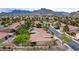 Delightful single-level home showcasing desert landscaping, a tile roof, and a peaceful community environment with mountain vistas at 10201 Los Padres Pl, Las Vegas, NV 89134