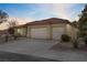 Charming single-story home with a two-car garage and well-maintained desert landscaping at 10201 Los Padres Pl, Las Vegas, NV 89134