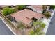 Quaint single-level house boasting a tile roof, xeriscaping, and a tranquil backyard setup on a quiet street at 10201 Los Padres Pl, Las Vegas, NV 89134