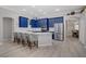 Modern kitchen with stainless steel appliances, blue cabinets, and island seating at 10201 Los Padres Pl, Las Vegas, NV 89134