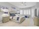 Airy main bedroom with stylish furniture, carpet, and walls in light neutral colors at 10201 Los Padres Pl, Las Vegas, NV 89134