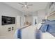 The main bedroom offers natural light, ceiling fan, TV, and leads to the office and ensuite bathroom at 10201 Los Padres Pl, Las Vegas, NV 89134