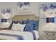 Close up shot of a comfy and luxurious main bedroom featuring soothing blue bedding and matching decor at 10201 Los Padres Pl, Las Vegas, NV 89134