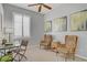 Office with a bright window, desk, and accent chairs at 10201 Los Padres Pl, Las Vegas, NV 89134