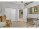 Neutral colored home office with light carpet and art on the wall at 10201 Los Padres Pl, Las Vegas, NV 89134