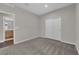 Empty bedroom with neutral carpet, closet, and attached bathroom at 10254 Kesington Dr, Las Vegas, NV 89135