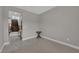 Bedroom with gray walls, patterned rug and entryway at 10254 Kesington Dr, Las Vegas, NV 89135
