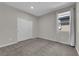 Neutral bedroom with closet and window showcasing natural light at 10254 Kesington Dr, Las Vegas, NV 89135