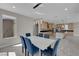 Elegant dining area features stylish chairs, a modern table, and contemporary lighting fixtures at 10254 Kesington Dr, Las Vegas, NV 89135