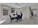 Well lit dining room with marble floors, a modern chandelier, and an open concept design at 10254 Kesington Dr, Las Vegas, NV 89135