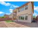 Contemporary home with a private balcony, stone accents, an irrigation system, and drought-resistant landscaping at 10254 Kesington Dr, Las Vegas, NV 89135