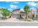 Charming two-story home featuring desert landscaping, stone accents and brick driveway at 10254 Kesington Dr, Las Vegas, NV 89135