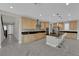Open-concept kitchen featuring stainless steel appliances, a central island, and abundant cabinet space at 10254 Kesington Dr, Las Vegas, NV 89135