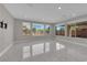 Bright living area with modern floors, natural light, and an expansive view of the landscape at 10254 Kesington Dr, Las Vegas, NV 89135