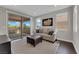 Living room featuring an outdoor view and neutral decor at 10254 Kesington Dr, Las Vegas, NV 89135