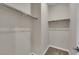 Simple walk-in closet with rod and shelf; ready for organization at 10254 Kesington Dr, Las Vegas, NV 89135