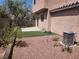 Well-maintained backyard with artificial turf, patio, and desert landscaping offering a low-maintenance outdoor space at 10719 Tottenham Ave, Las Vegas, NV 89135