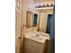 Bathroom featuring white vanity, a mirror, fixtures, and ample counter space at 10719 Tottenham Ave, Las Vegas, NV 89135