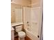 Bright bathroom featuring a bathtub, shower, toilet, and vanity with ample counter space at 10719 Tottenham Ave, Las Vegas, NV 89135