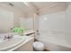 Clean bathroom featuring a shower-tub combo, neutral colors, and tiled floors at 10719 Tottenham Ave, Las Vegas, NV 89135