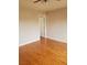 Inviting bedroom with hardwood floors, a ceiling fan, and neutral-toned walls at 10719 Tottenham Ave, Las Vegas, NV 89135
