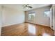 Bright and airy bedroom featuring hardwood floors and natural light at 10719 Tottenham Ave, Las Vegas, NV 89135