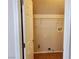 An open closet with shelving, tile floors, and an electrical outlet, ready for storage at 10719 Tottenham Ave, Las Vegas, NV 89135
