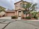 Charming two-story home featuring a tile roof, neat landscaping, and an attached two-car garage at 10719 Tottenham Ave, Las Vegas, NV 89135