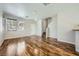 Bright living room with hardwood floors and open layout at 10719 Tottenham Ave, Las Vegas, NV 89135