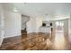 Spacious living room featuring hardwood floors, neutral paint, open layout at 10719 Tottenham Ave, Las Vegas, NV 89135