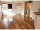 Spacious living room featuring hardwood floors, neutral paint, and natural light at 10719 Tottenham Ave, Las Vegas, NV 89135