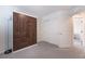 This neutral bedroom features a gray carpet, a Murphy bed, and a closet at 10987 Kingston Fields Ave, Las Vegas, NV 89166