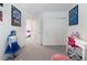 A brightly lit bedroom with carpeted floors and stylish furnishings at 10987 Kingston Fields Ave, Las Vegas, NV 89166