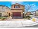 Inviting two-story home with brick driveway and an attached two-car garage at 10987 Kingston Fields Ave, Las Vegas, NV 89166