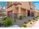 Charming two-story home with a two car garage, stone veneer and manicured landscaping at 10987 Kingston Fields Ave, Las Vegas, NV 89166