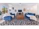 Bright living room with tile flooring, modern decor, a ceiling fan, and plenty of natural light at 10987 Kingston Fields Ave, Las Vegas, NV 89166