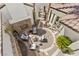 Aerial view of a secluded courtyard showcasing a fireplace, water feature, and inviting seating area at 11 Caminito Amore, Henderson, NV 89011