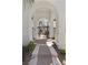 Inviting arched entryway leads to a private courtyard with a wrought iron gate at 11 Caminito Amore, Henderson, NV 89011