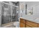 Modern bathroom with a glass-enclosed shower, sleek vanity, and contemporary tile at 11 Caminito Amore, Henderson, NV 89011