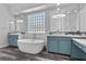 Luxurious bathroom featuring a soaking tub, double vanity, and modern fixtures at 11 Caminito Amore, Henderson, NV 89011