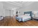 Bright, spacious bedroom with a tray ceiling, wood floors, and comfortable furnishings at 11 Caminito Amore, Henderson, NV 89011