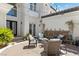 Charming courtyard with seating, stone accents, and lush greenery provides a relaxing outdoor space at 11 Caminito Amore, Henderson, NV 89011