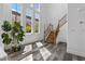 Bright foyer featuring hardwood floors, staircase, and large windows providing natural light at 11 Caminito Amore, Henderson, NV 89011