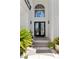 Grand front entrance features double doors, transom window, and manicured landscaping at 11 Caminito Amore, Henderson, NV 89011